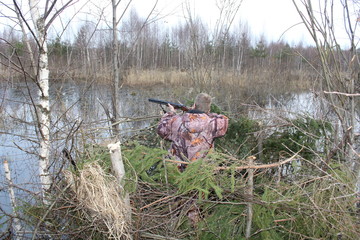 Fototapeta premium Early, spring morning on the reservoir, a view from the hunting shelter, designed for hunting ducks, geese and waders.