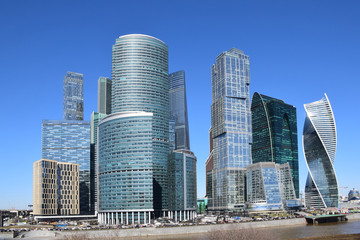 Fototapeta na wymiar High-rise buildings of the Moscow international business center Moscow-City on the bank of the Moskva River. The beginning of construction 1998. The construction continues. Moscow, April 2018