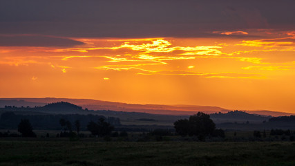 Majestic sunset in the mountains landscape. Dramatic sky.