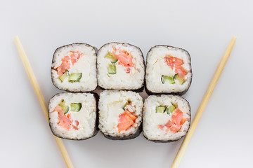 Traditional fresh japanese sushi rolls isolated on white background. Top view