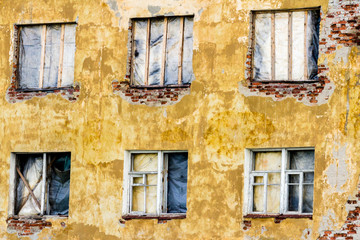 Fototapeta na wymiar Boarded up, dirty, wood window in an abandoned ruined house