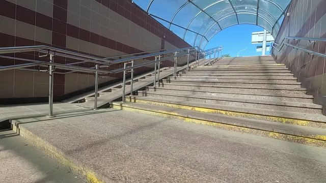 underground pedestrian crossing. barrier-free environment. metal railing.