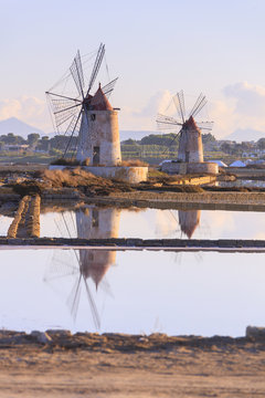 Windmills and salt flats at dawn, Saline dello Stagnone, Marsala, province of Trapani, Sicily, Mediterranean