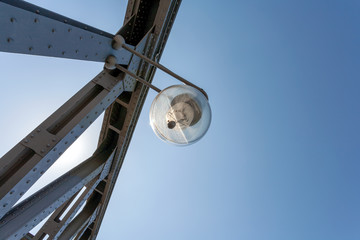 Lamp on a steel bridge, on a sunny afternoon