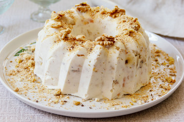 Curd cake sprinkled with walnuts