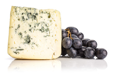Black grape cluster (autumn royal variety) with a blue mold cheese isolated on white background.