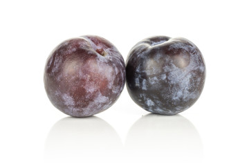 Two red blue plums isolated on white background round fresh fruit.