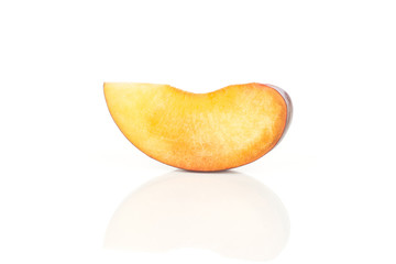 One red blue plum slice isolated on white background.