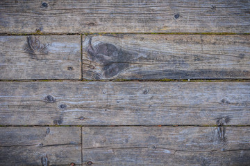 Old gray wooden floor or table of shabby boards with rough texture - retro background