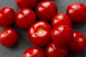 Cherry tomatoes on grey textured background