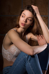 Test photo shoot for young sexy model wearing blue jeans and lace bra