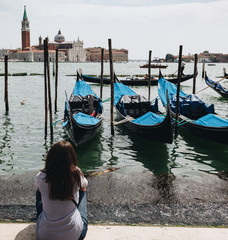 Fototapeta na wymiar girl looking panorama on the beautiful area of St Marco or Saint Mark's square. Venice, Italy