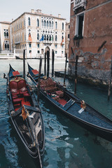 Fototapeta na wymiar Two gondolas parked on Grand Canal. Venice, Italy