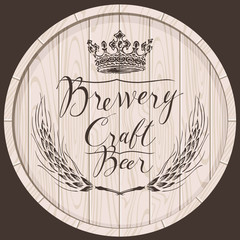 Vector label for craft beer and brewery on wooden barrel with handwritten inscription, crown and wheat or barley ears in retro style.