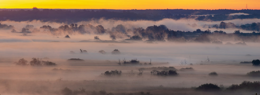 spectacular mist river over the river valley during the sunrise - Odra river, Germany around the town of Gartz