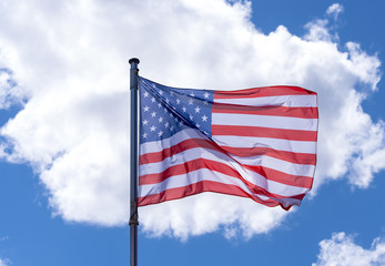 American Flag waving against blue Sky
