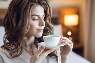Young girl with a cup of coffee