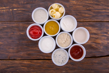 Obraz na płótnie Canvas Mustard sauce, sour cream sauce, sauce with greens, ketchup, butter, horse-radish sauce 