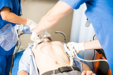 Emergency resuscitation procedure to save life - obrazy, fototapety, plakaty