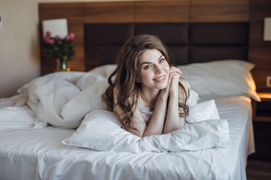 Young attractive girl in bed