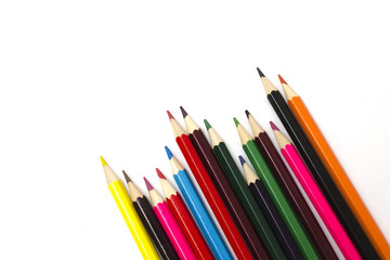 set of colored pencils in a row isolated on white