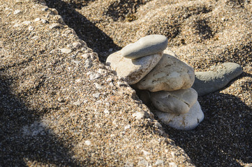 Sculpture. Stones on the beach