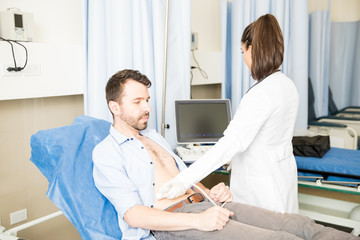 Man having ultrasound scan in hospital