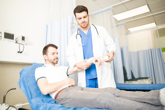 Doctor treating a patient in emergency room