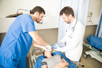 Doctors trying to stabilize patient's breathing