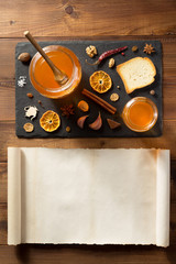 glass jar of honey on wood