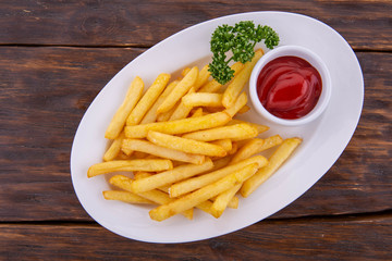 French fries with ketchup and greens