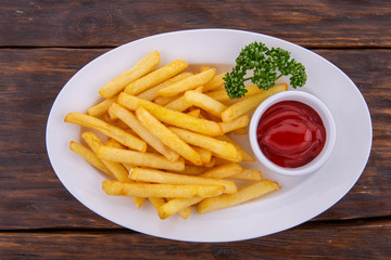 Fried French fries with fennel and ketchup

