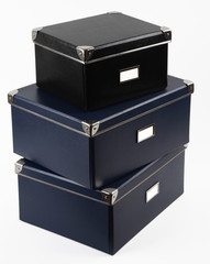 3 file boxes stacked on top of each other.