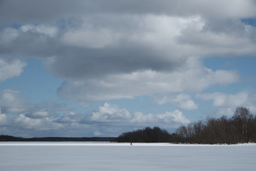 lake in winter, clouds in the sky, forest