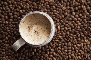 coffee beans and mug cappuccino, coffee, fresh ground coffee, cappuccino, coffee with milk for breakfast, coffee shop
