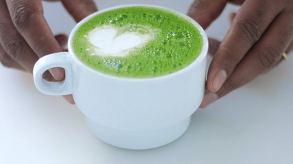 glass with a mathca tee closeup of cup with matcha