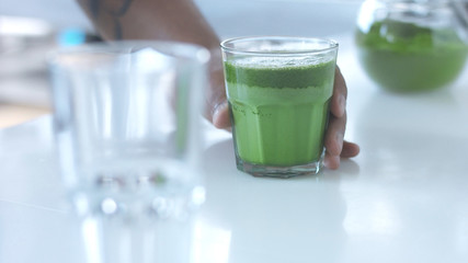 glass with a mathca tee closeup of glass with matcha