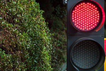 Modern LED traffic lights with red stop signal