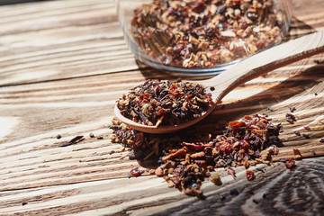 Dry tea in wood spoon