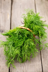 green dill on the wooden background