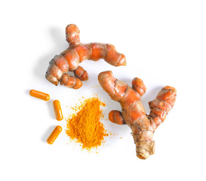 turmeric and capsule isolated on white background