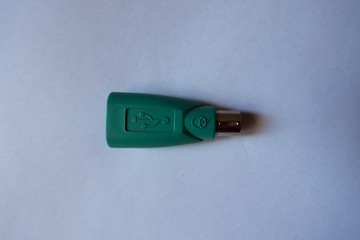 Top view of green USB to PS2 adapter