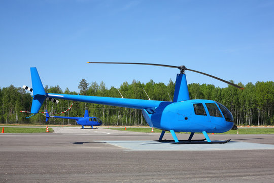 Aircraft - Two small blue helicopter side view