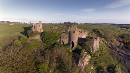 Fototapeta na wymiar The ruins of Pennard castle on the Gower peninsula in Swansea, South Wales, UK, overlooking Three Cliffs Bay