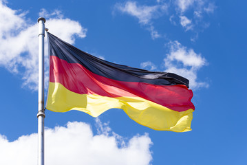 Flag of Germany against blue Sky in Berlin