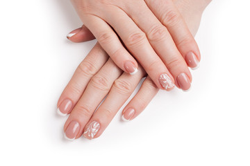 Stylish manicure. Hands of a woman on a white background. Closeup