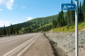 Sayany Mountains. The track. Summer sunny day. Outdoors