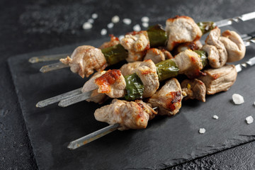 Shish kebabs on a black background. Still life.Close-up.