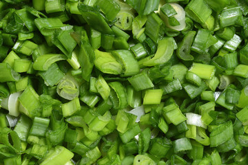Fototapeta na wymiar Bright and fresh chopped green onions. Texture. Close-up