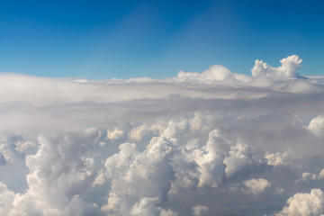 Fototapeta premium View above the clouds from air plane.